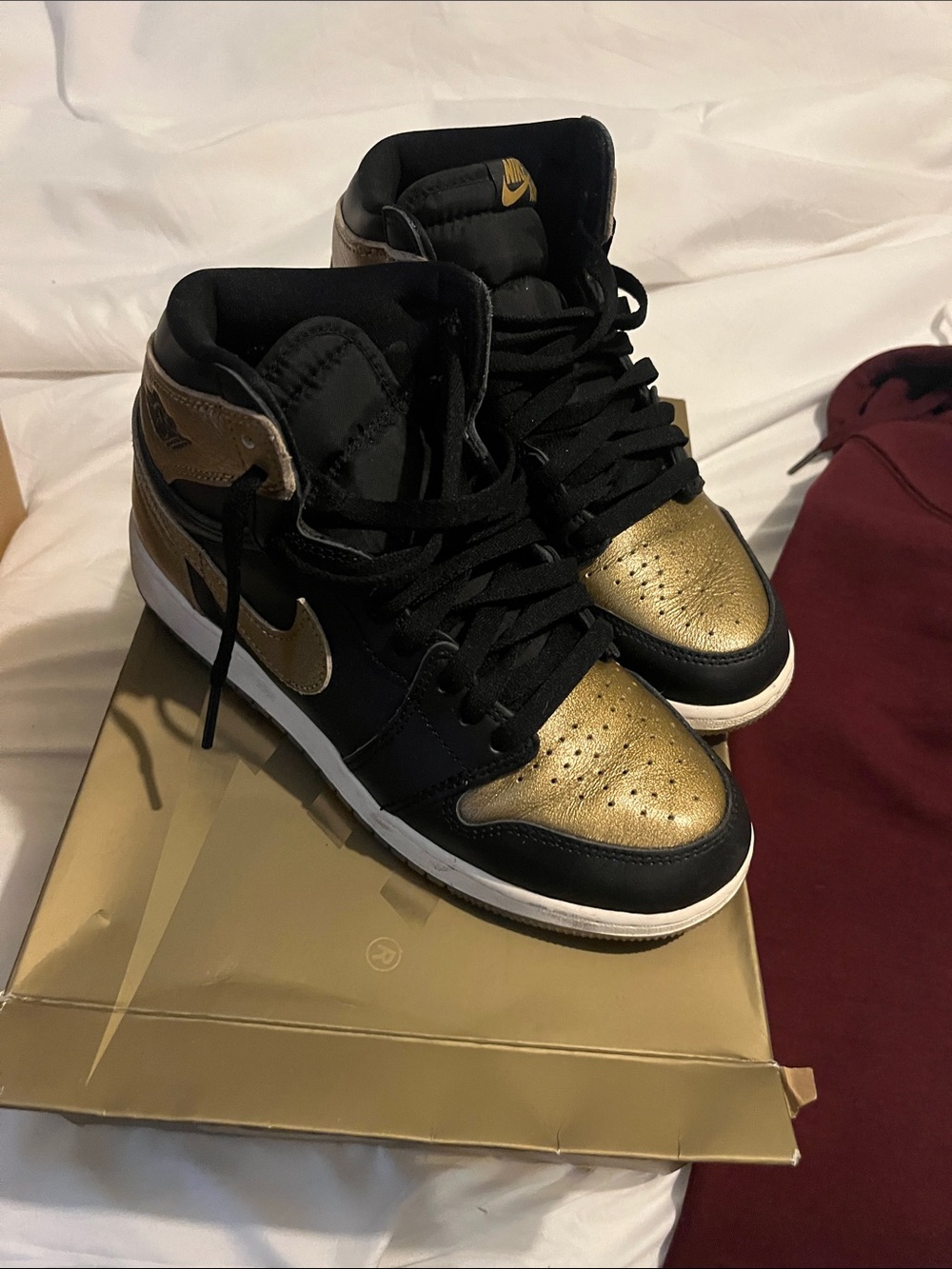 Nike Women’s Black and Gold High-Top Sneakers